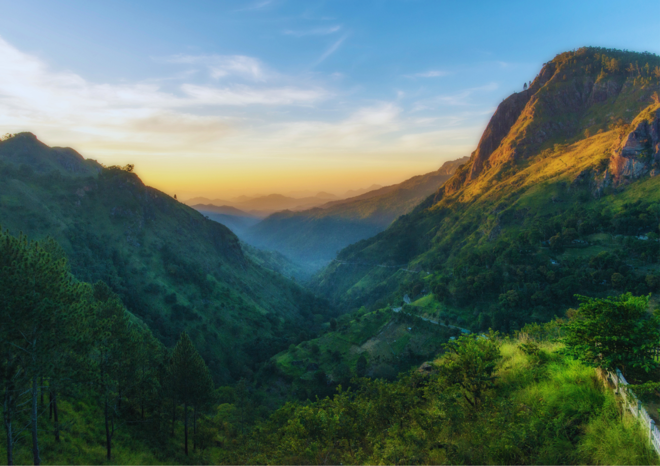 Sunset over a mountainous valley in Kenya, showcasing the scenic highlands where Kirenge Gold premium Kenyan coffee beans are grown.