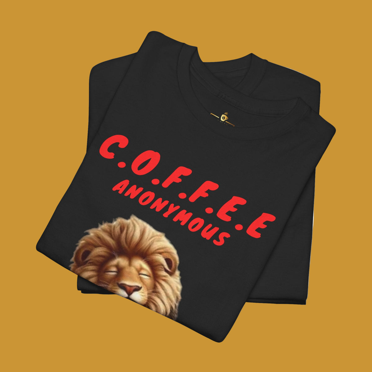 Black t-shirt with a lion holding a coffee cup and text Coffee Anonymous. Kirenge Gold Coffee Anonymous T-shirt